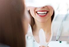 Woman smiling in mirror